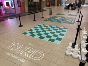 floor graphics with chess piece features on commercial property