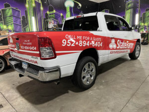 red and white commercial pickup truck wrap