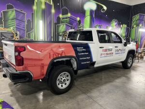 red, white, and black, commercial pickup truck wrap